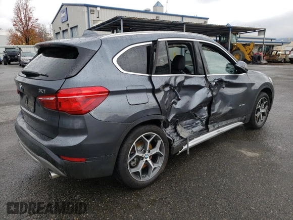 2018 BMW X1 xDrive28i with VIN WBXHT3C33J5K23187, listed as a Copart auction lot 71063192 with 97,403 mi miles. Bid and sale history available at carsss.com. Image 3.