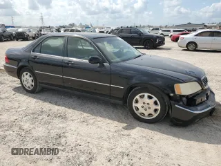 1999 Acura RL with VIN JH4KA9657XC005748, listed as a Copart auction lot 67048184 with 0 mi miles and Salvage Title. Bid and sale history available at carsss.com. Image 4.