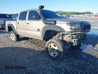2006 Toyota Tacoma z VIN 3TMLU42N06M007859, wystawiony jako IAAI lot #41977767 z przebiegiem 160 932 mil mil oraz . Historia ofert i sprzedaży dostępna na DreamBid. Obrazek 1.