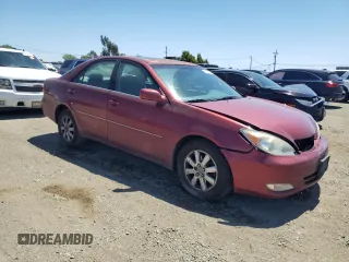 2003 Toyota Camry LE z VIN 4T1BF30K23U056007, wystawiony jako Copart lot #55187435 z przebiegiem 233 976 mil mil oraz Czysty tytuł • Clean title. Historia ofert i sprzedaży dostępna na DreamBid. Obrazek 4.