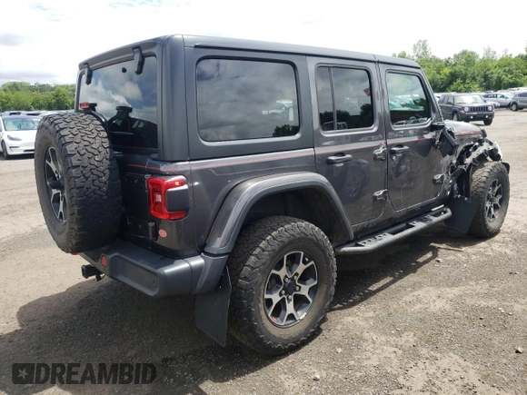 2018 Jeep Wrangler Unlimited Rubicon with VIN 1C4HJXFG1JW261472, listed as a Copart auction lot 63259345 with 60,457 mi miles and Salvage title. Bid and sale history available at DreamBid. Image 3.