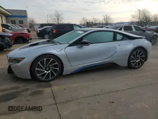 2015 BMW i8 z VIN WBY2Z2C56FV674231, wystawiony jako Copart lot #37218014 z przebiegiem 27 465 mil mil oraz . Historia ofert i sprzedaży dostępna na DreamBid. Obrazek 1.