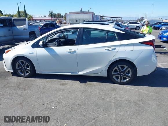 2020 Toyota Prius L Eco with VIN JTDKARFUXL3107211, listed as a IAAI auction lot 42797561 with 328,023 mi miles and . Bid and sale history available at DreamBid. Image 14.