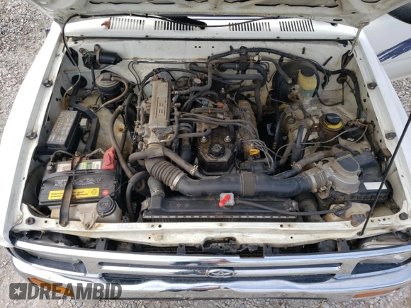 1993 Toyota Pickup DLX z VIN JT4RN93P7P5074129, wystawiony jako Copart lot #72893054 z przebiegiem 235 053 mil mil oraz Szkoda całkowita • Salvage title. Historia ofert i sprzedaży dostępna na DreamBid. Obrazek 13.