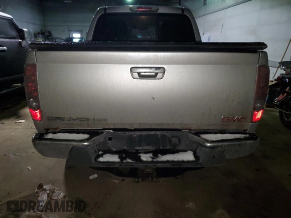 2010 GMC Canyon z VIN 1GTJTFDE0A8105967, wystawiony jako Copart lot #42169555 z przebiegiem 230 257 mil mil oraz Czysty tytuł • Clean title. Historia ofert i sprzedaży dostępna na DreamBid. Obrazek 6.