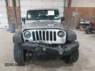 2014 Jeep Wrangler Sport with VIN 1C4AJWAG0EL173362, listed as a IAAI auction lot 42231863 with 99,321 mi miles and . Bid and sale history available at DreamBid. Image 12.