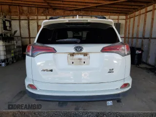 2017 Toyota RAV4 LE with VIN JTMBFREV7HJ148815, listed as a Copart auction lot 82632724 with 24,775 mi miles and Salvage Title. Bid and sale history available at DreamBid. Image 6.