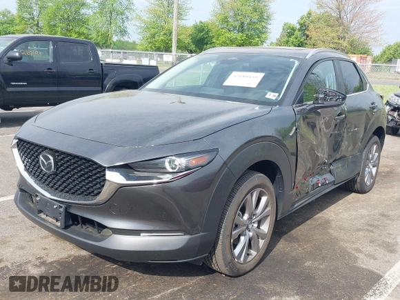 2024 Mazda CX-30 S Carbon Edition with VIN 3MVDMBCM5RM665341, listed as a IAAI auction lot 42180459 with 4,496 mi miles and . Bid and sale history available at DreamBid. Image 2.