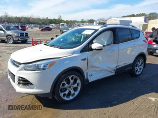2014 Ford Escape Titanium with VIN 1FMCU9JX7EUD17335, listed as a IAAI auction lot 41302107 with 104,352 mi miles and . Bid and sale history available at DreamBid. Image 16.