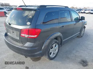 2014 Dodge Journey SE with VIN 3C4PDCAB0ET283756, listed as a IAAI auction lot 41490472 with 122,695 mi miles. Bid and sale history available at carsss.com. Image 4.