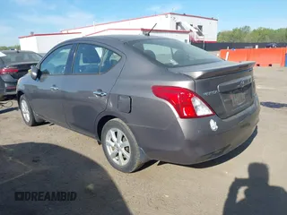2014 Nissan Versa SV with VIN 3N1CN7AP2EL877539, listed as a IAAI auction lot 42107642 with 122,616 mi miles. Bid and sale history available at carsss.com. Image 3.