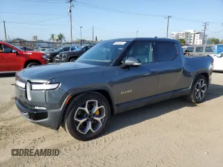 2022 Rivian R1T Adventure z VIN 7FCTGAAA9NN008771, wystawiony jako Copart lot #56243835 z przebiegiem 31 006 mil mil oraz Szkody całkowita. Historia ofert i sprzedaży dostępna na DreamBid. Obrazek 1.