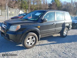 2007 Honda Pilot LX with VIN 5FNYF18177B017068, listed as a IAAI auction lot 41844268 with 164,145 mi miles. Bid and sale history available at carsss.com. Image 2.