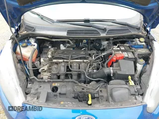 2018 Ford Fiesta SE z VIN 3FADP4BJXJM126168, wystawiony jako IAAI lot #42255261 z przebiegiem 121 248 mil mil oraz . Historia ofert i sprzedaży dostępna na DreamBid. Obrazek 10.