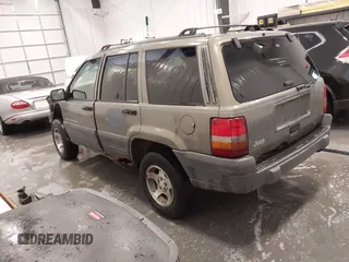 1997 Jeep Grand Cherokee Laredo with VIN 1J4GZ58S2VC746778, listed as a IAAI auction lot 41225925 with 196,679 mi miles. Bid and sale history available at carsss.com. Image 3.