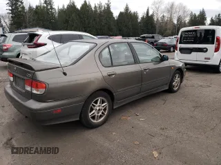 2000 Infiniti G20 Luxury z VIN JNKCP11A5YT303404, wystawiony jako Copart lot #82801234 z przebiegiem 178 185 mil mil oraz Tytuł czysty. Historia ofert i sprzedaży dostępna na DreamBid. Obrazek 3.