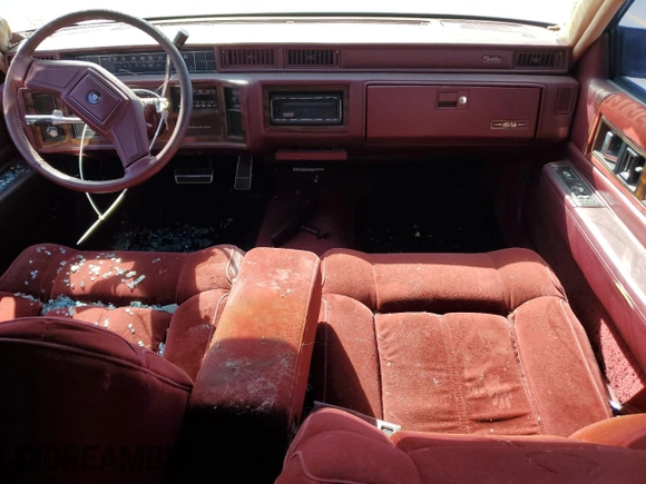 1989 Cadillac DeVille z VIN 1G6CD5151K4329443, wystawiony jako Copart lot #73939314 z przebiegiem 80 129 mil mil oraz Czysty tytuł • Clean title. Historia ofert i sprzedaży dostępna na DreamBid. Obrazek 8.