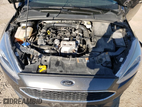 2018 Ford Focus SE z VIN 1FADP3FE4JL306237, wystawiony jako Copart lot #56482215 z przebiegiem 102 241 mil mil oraz Czysty tytuł • Clean title. Historia ofert i sprzedaży dostępna na DreamBid. Obrazek 11.