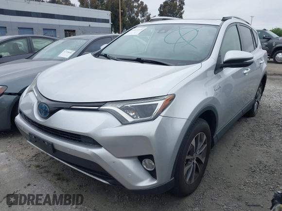 2016 Toyota RAV4 Hybrid XLE with VIN JTMRJREVXGD029019, listed as a IAAI auction lot 42021530 with 74,400 mi miles. Bid and sale history available at carsss.com. Image 23.