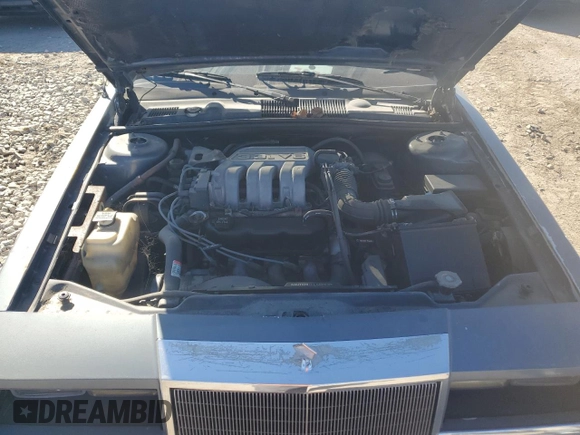 1990 Chrysler New Yorker z VIN 1C3XY66R4LD784183, wystawiony jako Copart lot #75364784 z przebiegiem 114 456 mil mil oraz Tytuł czysty. Historia ofert i sprzedaży dostępna na DreamBid. Obrazek 11.