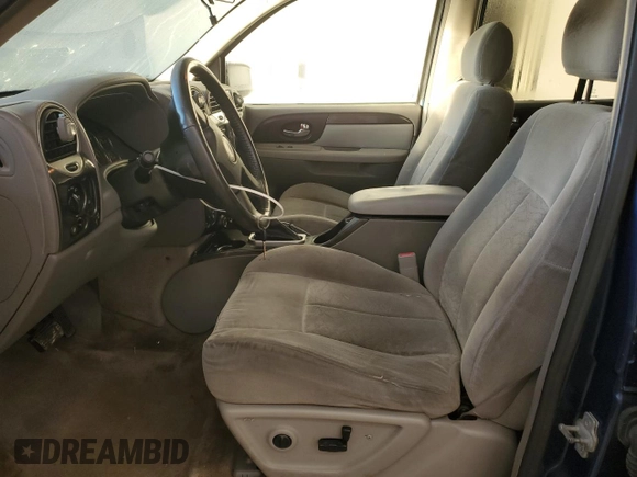 2005 GMC Envoy SLT with VIN 1GKDS13S652339845, listed as a Copart auction lot 77693684 with 220,306 mi miles and Salvage Title. Bid and sale history available at carsss.com. Image 7.