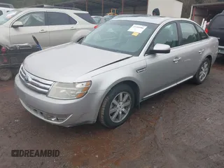 2008 Ford Taurus SEL with VIN 1FAHP24W78G105183, listed as a IAAI auction lot 41441086 with 215,758 mi miles. Bid and sale history available at carsss.com. Image 2.