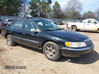 1999 Lincoln Continental with VIN 1LNHM97V8XY686521, listed as a IAAI auction lot 41681027 with 144,407 mi miles. Bid and sale history available at carsss.com. Image 1.