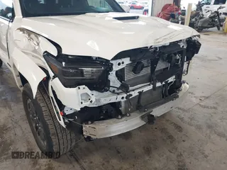 2025 Toyota Tacoma SR with VIN 3TMLB5JN2SM090394, listed as a IAAI auction lot 41916312 with 840 mi miles and . Bid and sale history available at DreamBid. Image 6.