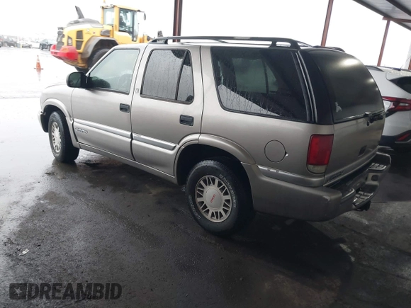 1999 GMC Jimmy SLE with VIN 1GKDT13W7X2529298, listed as a IAAI auction lot 41556249 with 114,750 mi miles. Bid and sale history available at carsss.com. Image 3.