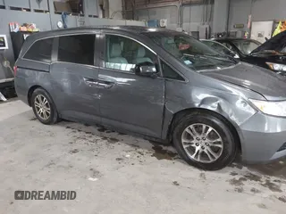 2012 Honda Odyssey EX-L with VIN 5FNRL5H63CB137198, listed as a IAAI auction lot 42706690 with 305,753 mi miles and . Bid and sale history available at DreamBid. Image 6.