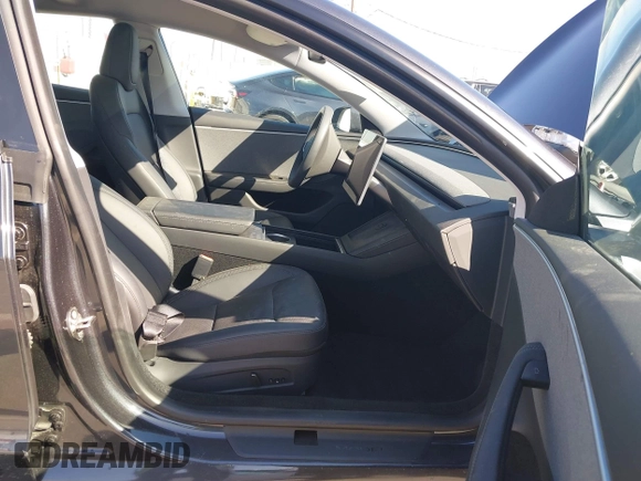 2024 Tesla Model 3 with VIN 5YJ3E1EA7RF717855, listed as a IAAI auction lot 41838814 with 8,750 mi miles and . Bid and sale history available at DreamBid. Image 5.