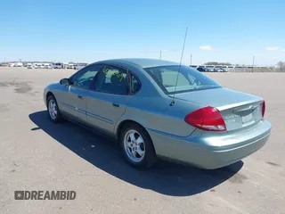 2005 Ford Taurus SE with VIN 1FAFP53U05A273576, listed as a IAAI auction lot 42140404 with 58,735 mi miles. Bid and sale history available at carsss.com. Image 3.