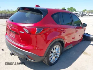 2015 Mazda CX-5 Grand Touring with VIN JM3KE4DY5F0469439, listed as a IAAI auction lot 42053851 with 70,676 mi miles. Bid and sale history available at carsss.com. Image 4.