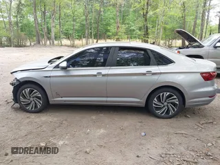 2020 Volkswagen Jetta SEL z VIN 3VWE57BU9LM082552, wystawiony jako IAAI lot #42091492 z przebiegiem 60 775 mil mil oraz . Historia ofert i sprzedaży dostępna na DreamBid. Obrazek 14.