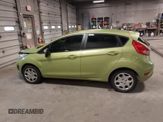2013 Ford Fiesta SE with VIN 3FADP4EJ9DM131913, listed as a IAAI auction lot 41677333 with 54,673 mi miles. Bid and sale history available at carsss.com. Image 14.
