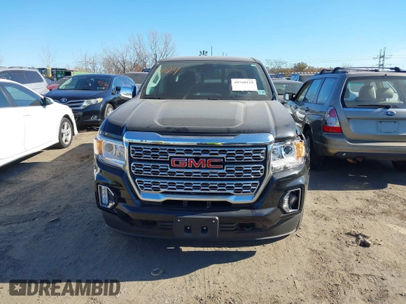 2021 GMC Canyon 4WD Denali z VIN 1GTG6EEN9M1240596, wystawiony jako IAAI lot #40760124 z przebiegiem 52 985 mil mil oraz . Historia ofert i sprzedaży dostępna na DreamBid. Obrazek 12.