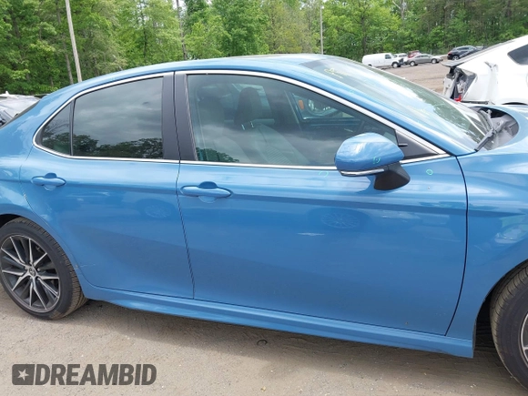 2023 Toyota Camry SE z VIN 4T1T11AK0PU115695, wystawiony jako IAAI lot #42221720 z przebiegiem 67 575 mil mil oraz . Historia ofert i sprzedaży dostępna na DreamBid. Obrazek 13.