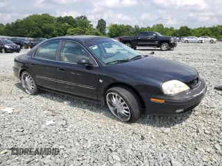 2002 Mercury Sable LS Premium with VIN 1MEHM55S02A621328, listed as a Copart auction lot 59556805 with 183,594 mi miles and Salvage title. Bid and sale history available at DreamBid. Image 4.