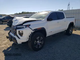 2024 GMC Canyon 4WD AT4 with VIN 1GTP6DEK1R1144016, listed as a Copart auction lot 74384234 with 112 mi miles and Salvage Title. Bid and sale history available at carsss.com. Image 1.