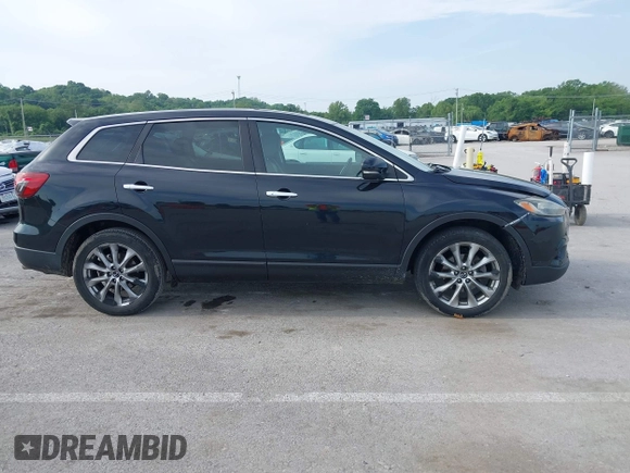 2015 Mazda CX-9 Grand Touring z VIN JM3TB2DA1F0456773, wystawiony jako IAAI lot #42257555 z przebiegiem 152 890 mil mil oraz . Historia ofert i sprzedaży dostępna na DreamBid. Obrazek 13.