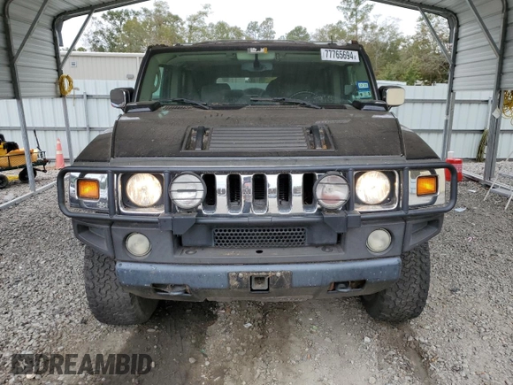 2003 Hummer H2 with VIN 5GRGN23U33H118459, listed as a Copart auction lot 77765694 with 157,390 mi miles and Salvage Title. Bid and sale history available at carsss.com. Image 5.
