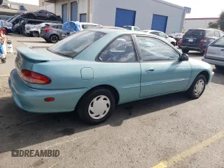 1994 Plymouth Colt z VIN JP3EA21A8RU055081, wystawiony jako Copart lot #77993974 z przebiegiem 77 110 mil mil oraz Czysty tytuł • Clean title. Historia ofert i sprzedaży dostępna na DreamBid. Obrazek 3.