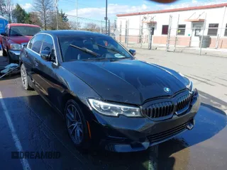 2020 BMW 3 Series 330i xDrive with VIN WBA5R7C06LFH40038, listed as a IAAI auction lot 41780401 with 100,588 mi miles. Bid and sale history available at carsss.com. Image 1.