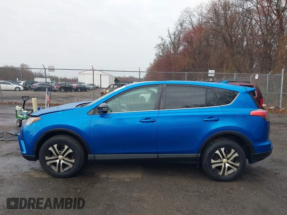 2016 Toyota RAV4 LE with VIN JTMBFREV9GJ100635, listed as a IAAI auction lot 41858669 with 171,644 mi miles. Bid and sale history available at carsss.com. Image 14.