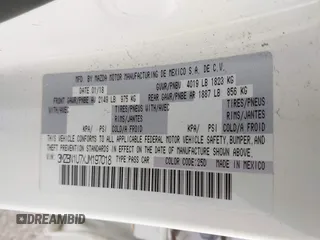 2018 Mazda 3 Sport z VIN 3MZBN1U7XJM197018, wystawiony jako IAAI lot #42229988 z przebiegiem 82 555 mil mil oraz . Historia ofert i sprzedaży dostępna na DreamBid. Obrazek 9.