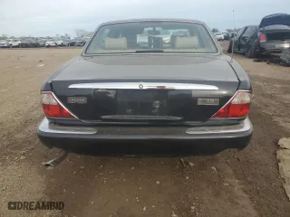 2000 Jaguar XJ with VIN SAJDA14C7YLF11390, listed as a Copart auction lot 73054184 with 0 mi miles and Salvage Title. Bid and sale history available at carsss.com. Image 6.