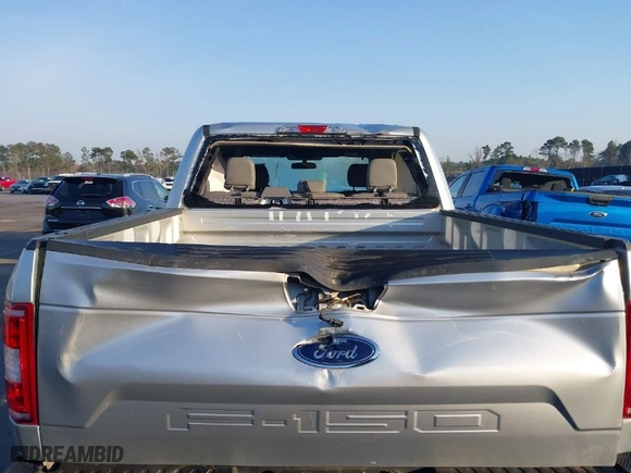 2018 Ford F-150 XL with VIN 1FTEW1E57JFC31779, listed as a IAAI auction lot 41784467 with 142,676 mi miles. Bid and sale history available at carsss.com. Image 6.