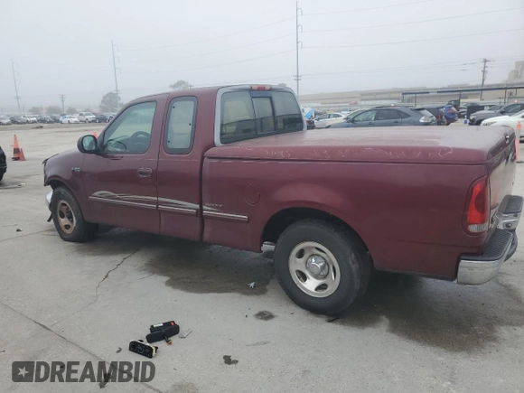 1997 Ford F-150 with VIN 2FTDX1726VCA74811, listed as a Copart auction lot 81909844 with 136,520 mi miles and Salvage title. Bid and sale history available at DreamBid. Image 2.