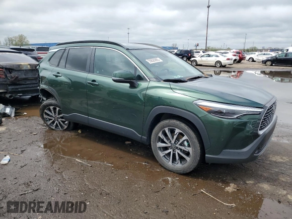 2022 Toyota Corolla Cross XLE with VIN 7MUDAABG6NV006829, listed as a Copart auction lot 55626965 with 23,187 mi miles and Salvage title. Bid and sale history available at DreamBid. Image 4.