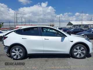 2023 Tesla Model Y Long Range with VIN 7SAYGAEE5PF855834, listed as a IAAI auction lot 41943491 with 34,480 mi miles. Bid and sale history available at carsss.com. Image 21.